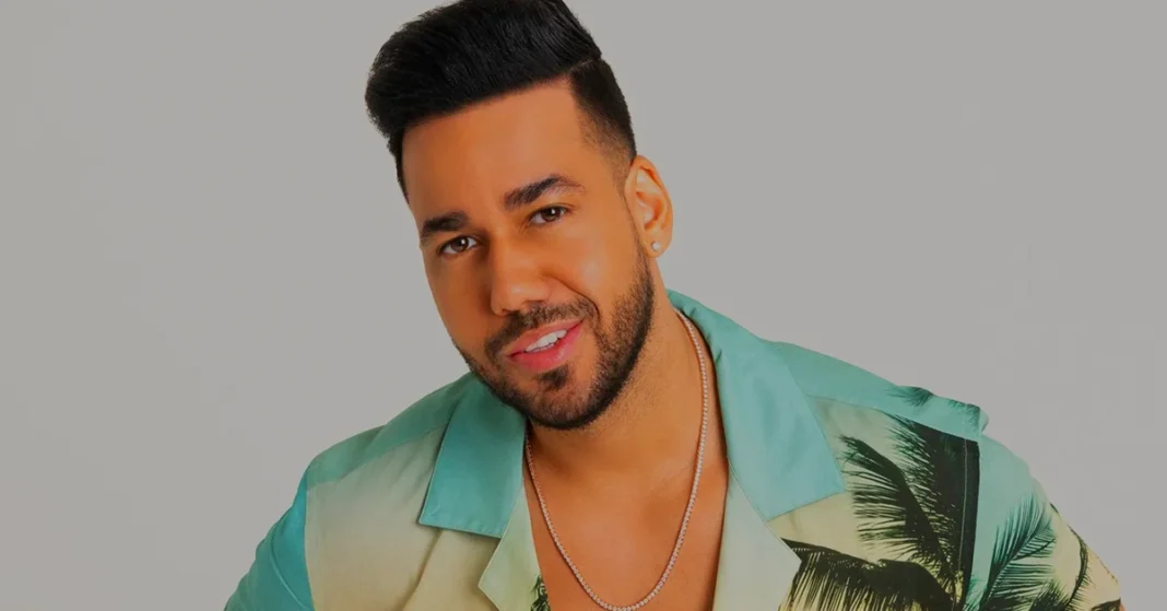 Romeo Santos, the King of Bachata, smiling in a stylish tropical shirt, showcasing his iconic look and charisma.